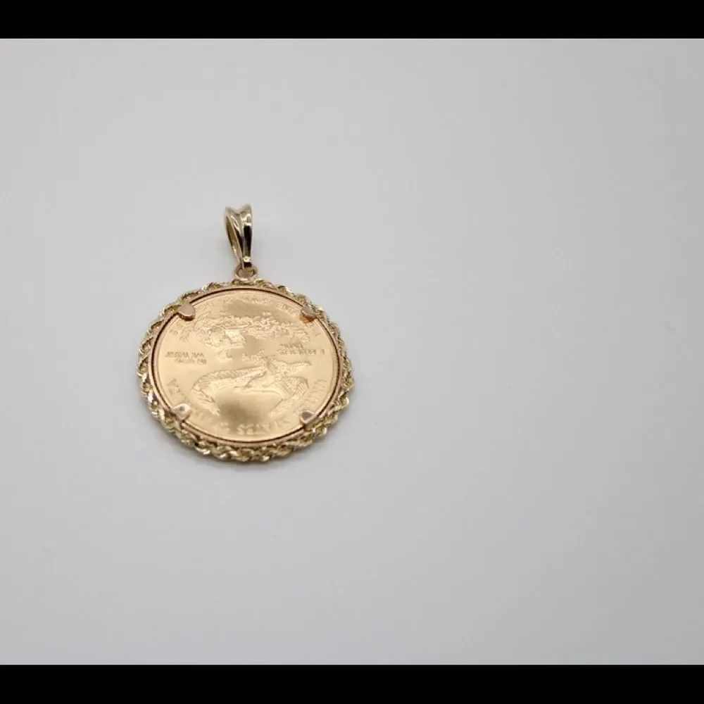 New 22k gold American Eagle 1/2 ounce coin mounted in 14k gold coin bezel